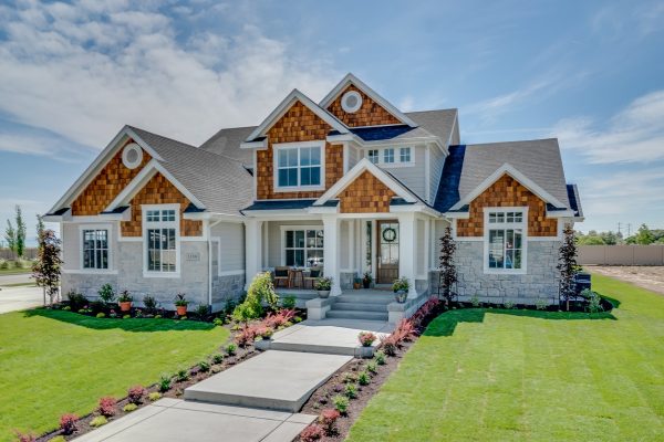 Traditional home with natural wood, siding and stone exterior