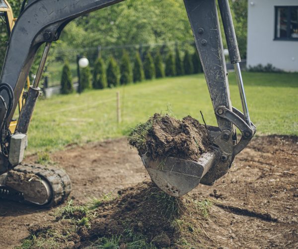 Working Excavator Digging A Trench At Construction Site